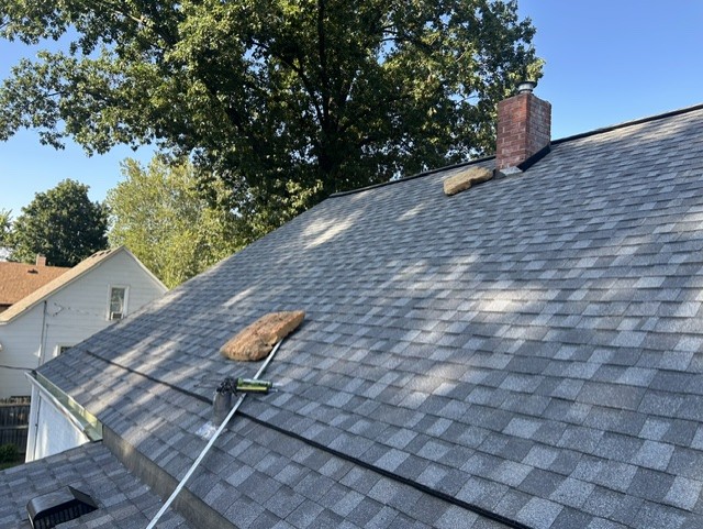 Repaired roof slope up to the chimney