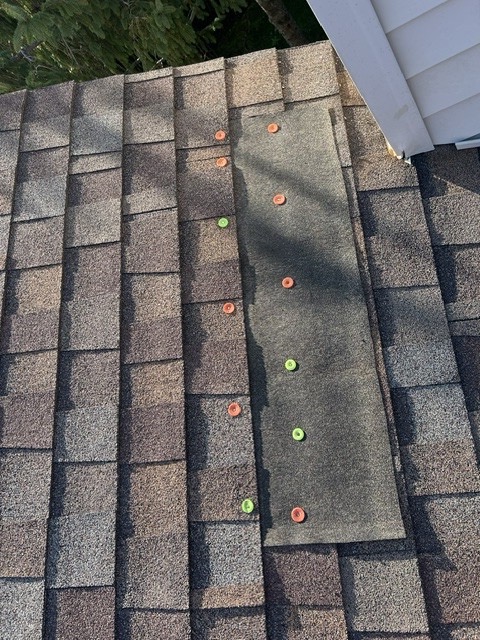 Storm patch marked and re-nailed