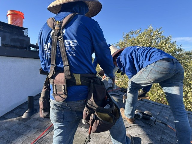 Barnes crew in harnesses working the upper slope