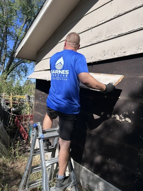 Barnes crew removing old siding